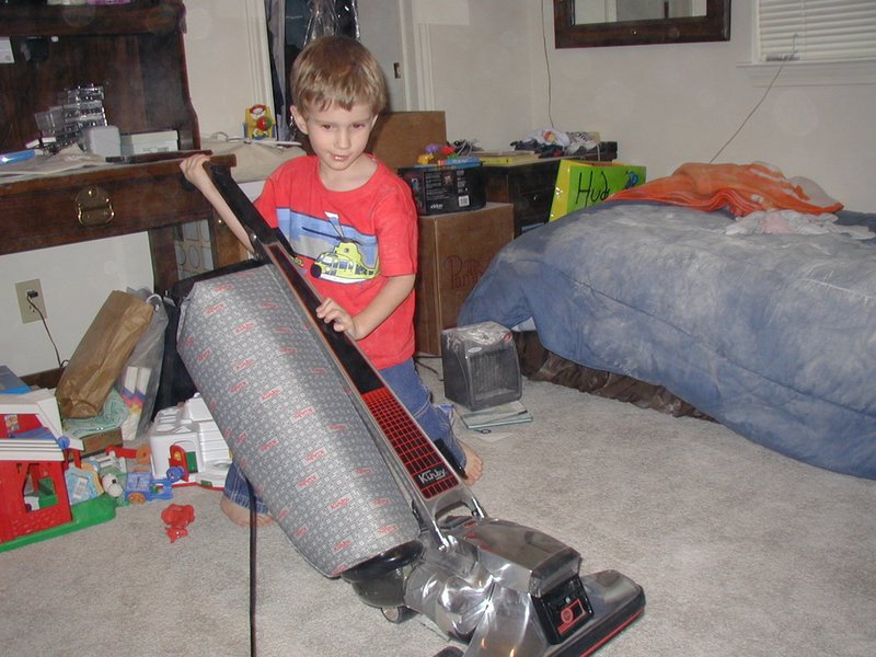2003-03-11 17-03-38-Chance-cleaning-Daxs-room-baby-powder.JPG